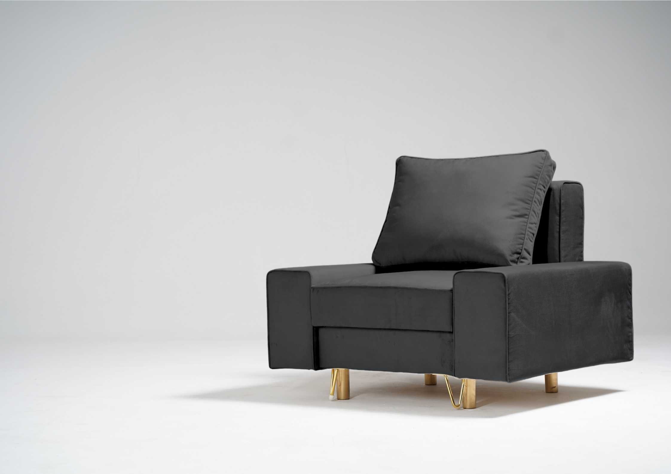 Grafitowy fotel na złotych nogach